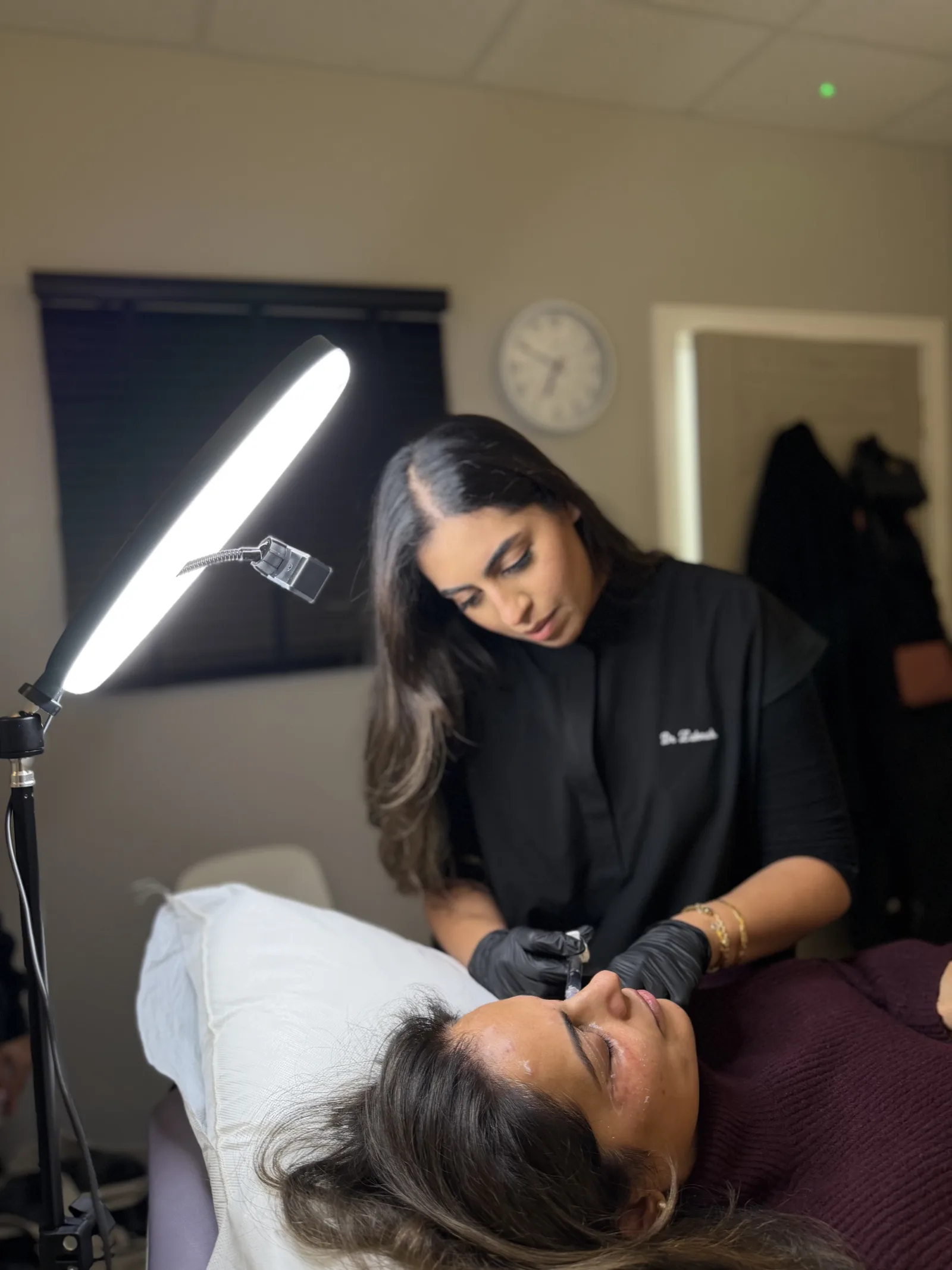 Dr. Zahrah performing a dermal filler treatment